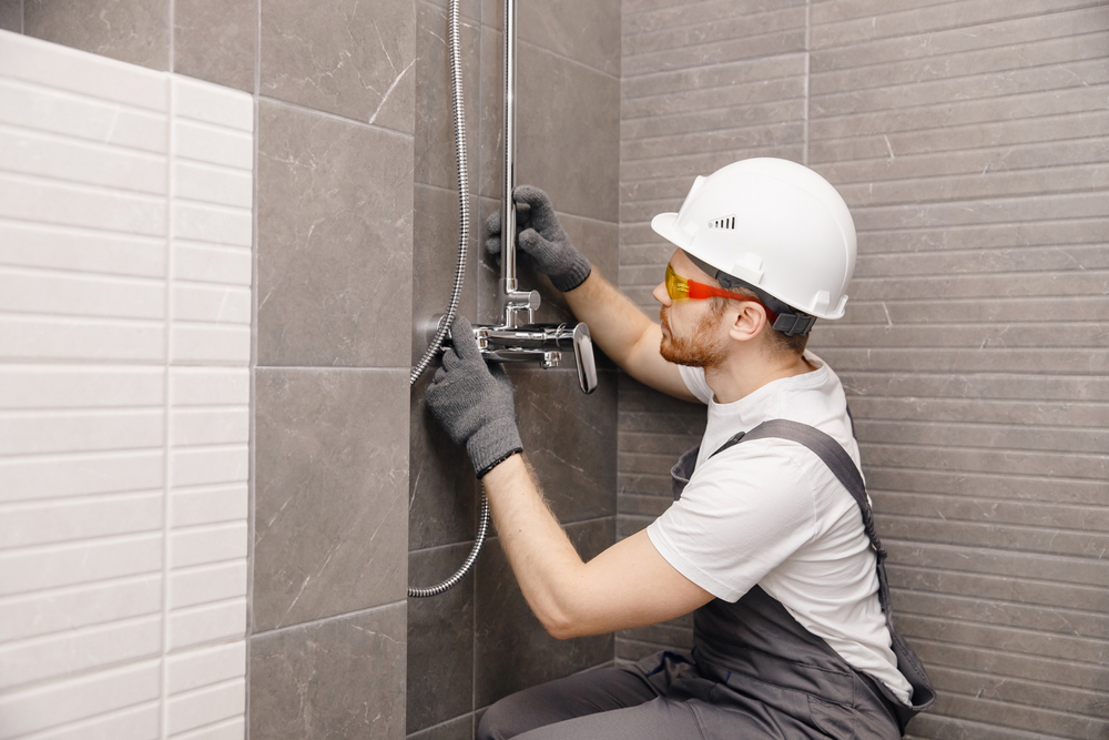 R&F Plumbing Solutions engineer completing a job in Lancashire
